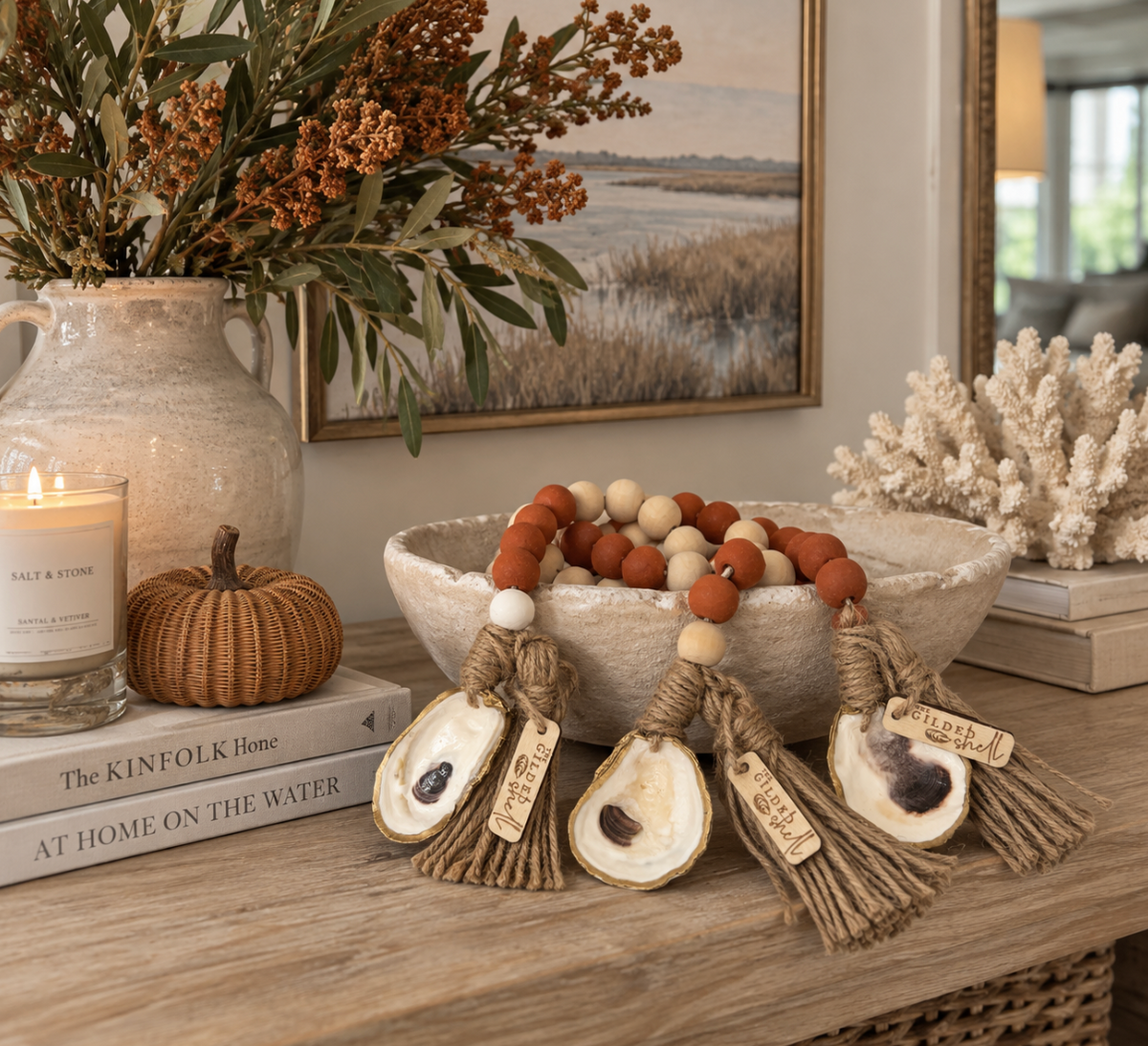 Coastal Thanksgiving oyster shell decor with a rustic tassel garland for a mantel or console table