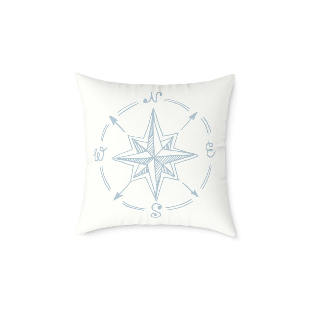 True North Throw Pillow featuring a blue nautical compass rose with N, E, S, W on white fabric.