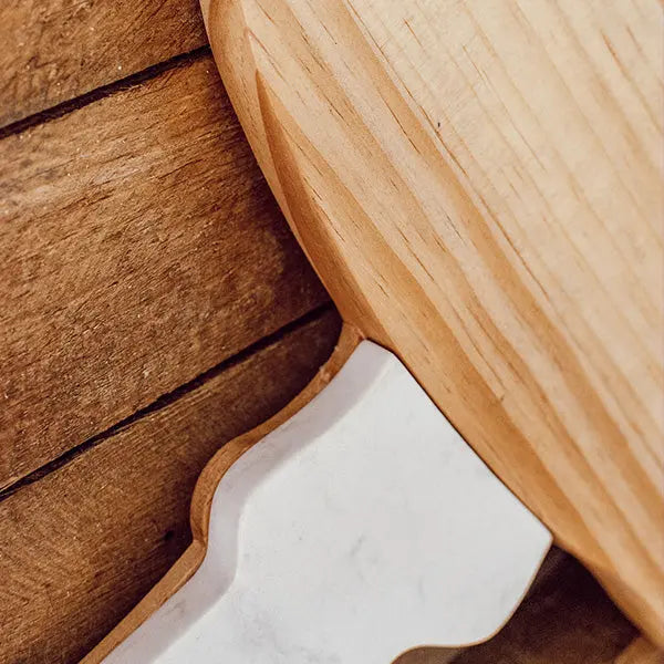 Marble and Wood Mushroom Cutting Board with white marble inset in natural wood.