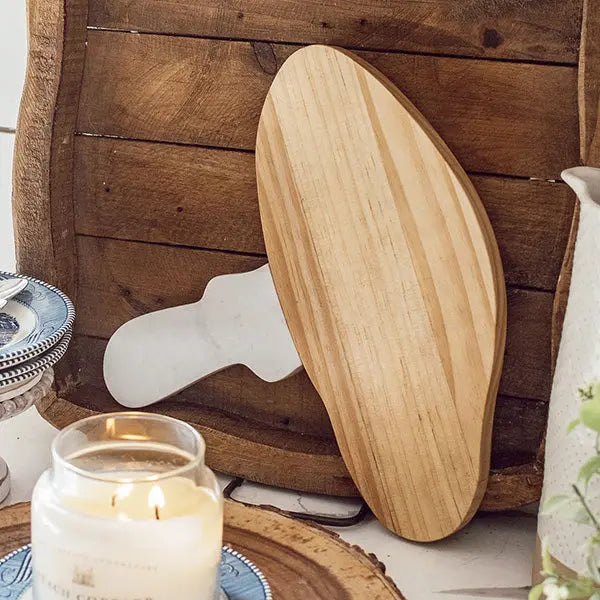 Marble and Wood Mushroom Cutting Board blends finished wood with marble for a playful, polished statement piece.