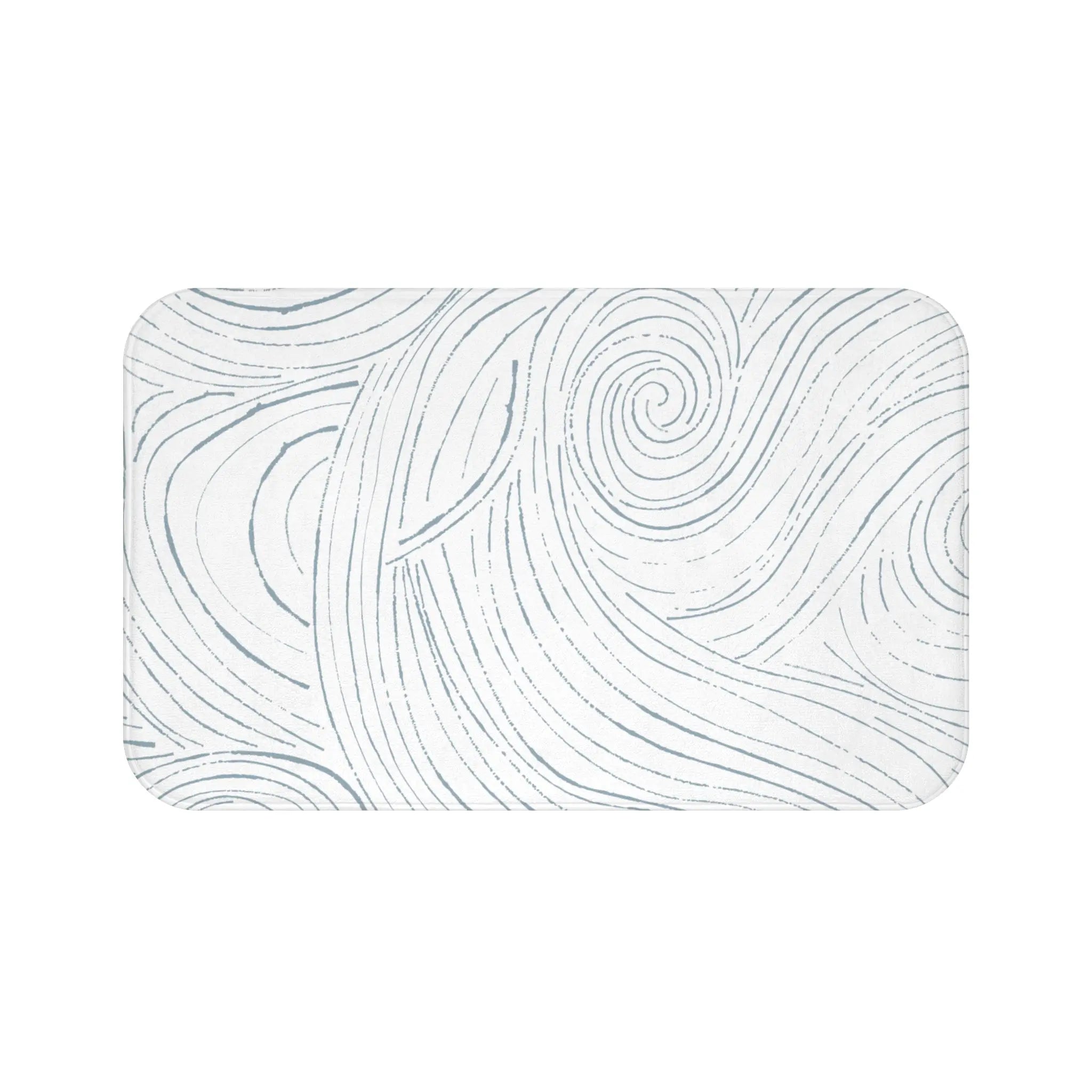 Coastal abstract bath mat in front of a bathtub on a light tile floor