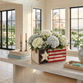 Americana flag storage and flower box styled as patriotic coastal decor.