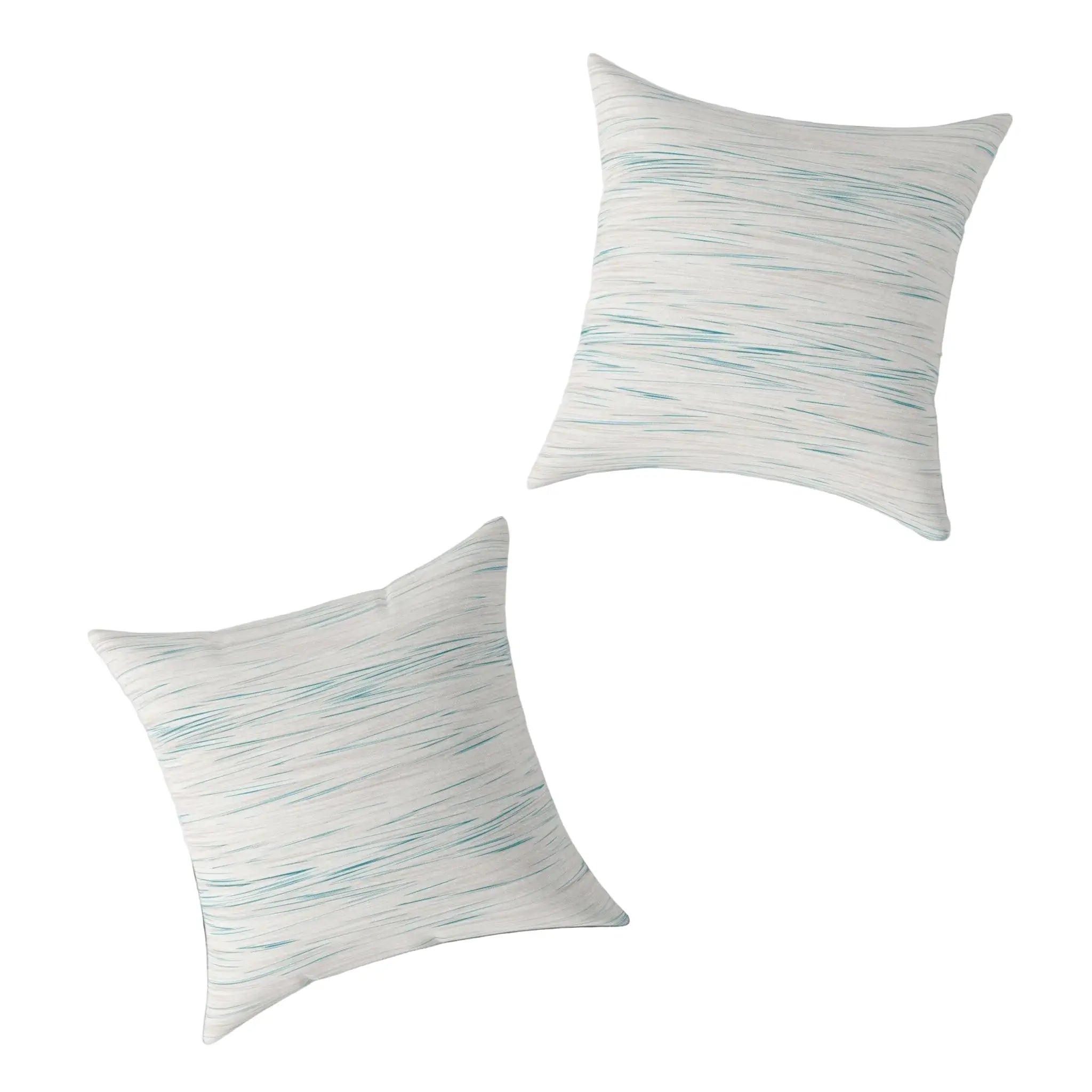 Two Coastal Breeze square pillows with blue watercolor stripes on a light linen-like cover.