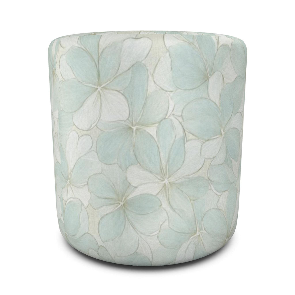Aqua and white flower-print round ottoman pair for light, airy coastal or transitional home décor.