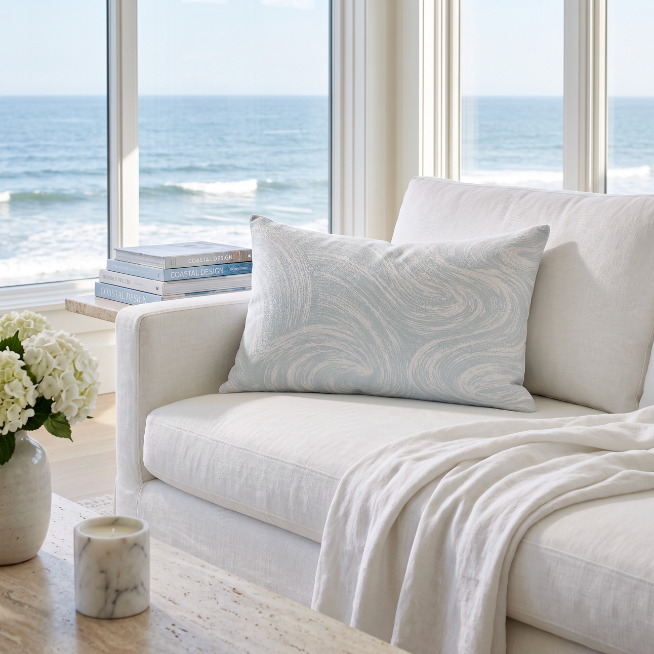Aqua coastal wave print lumbar pillow for modern beach house style and relaxed sofa layering.