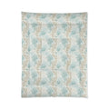 Closeup of aqua coral pattern on soft coastal comforter set.