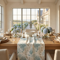 Aqua and white coral pattern table runner on a natural wood coastal dining table