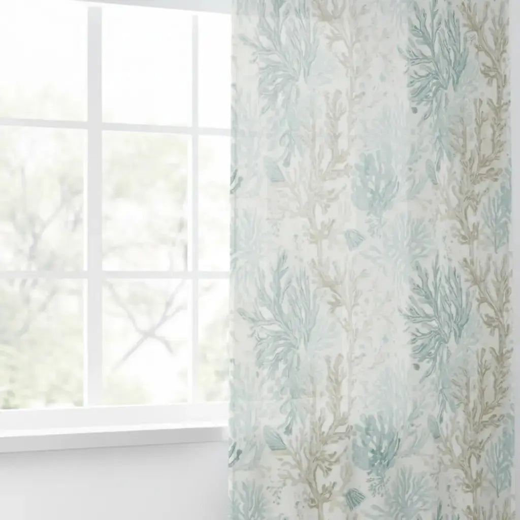 Aqua coastal coral sheer curtain panels softly filtering light in a seaside living room