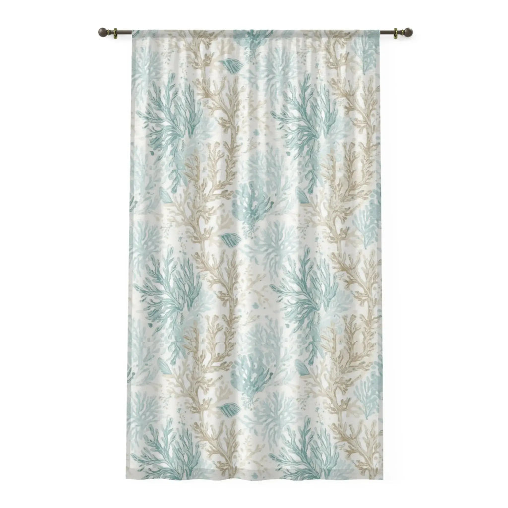 Closeup of white and aqua coral motif on coastal sheer curtain fabric