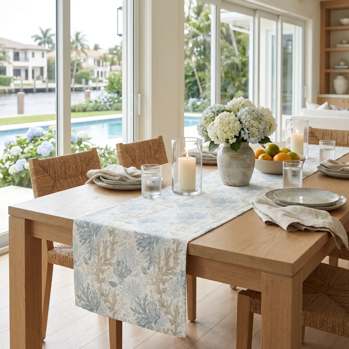 Aqua coral table runner styled with seashells for an ocean-inspired beach house tablescape