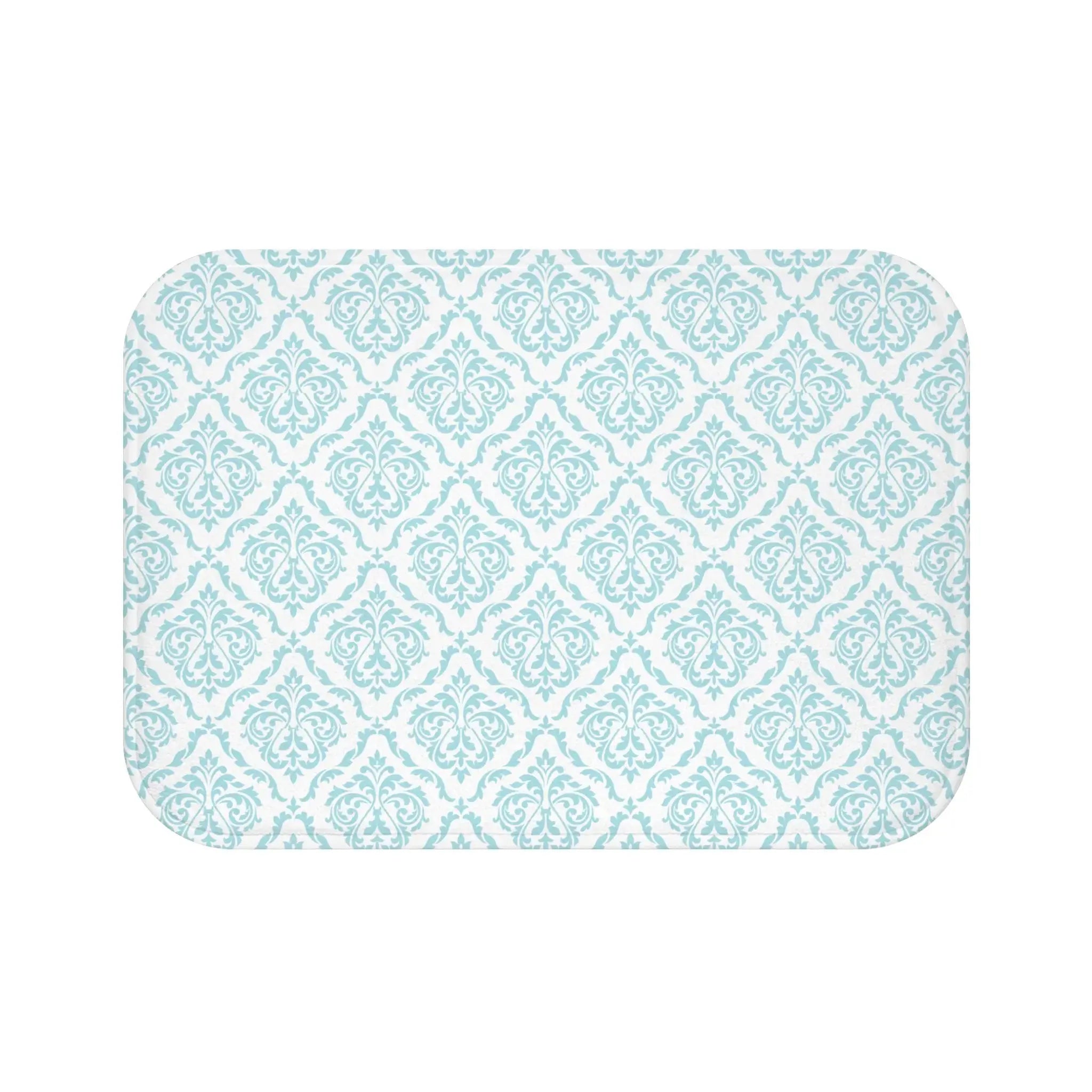 Soft aqua damask bath mat adding color to a coastal bathroom