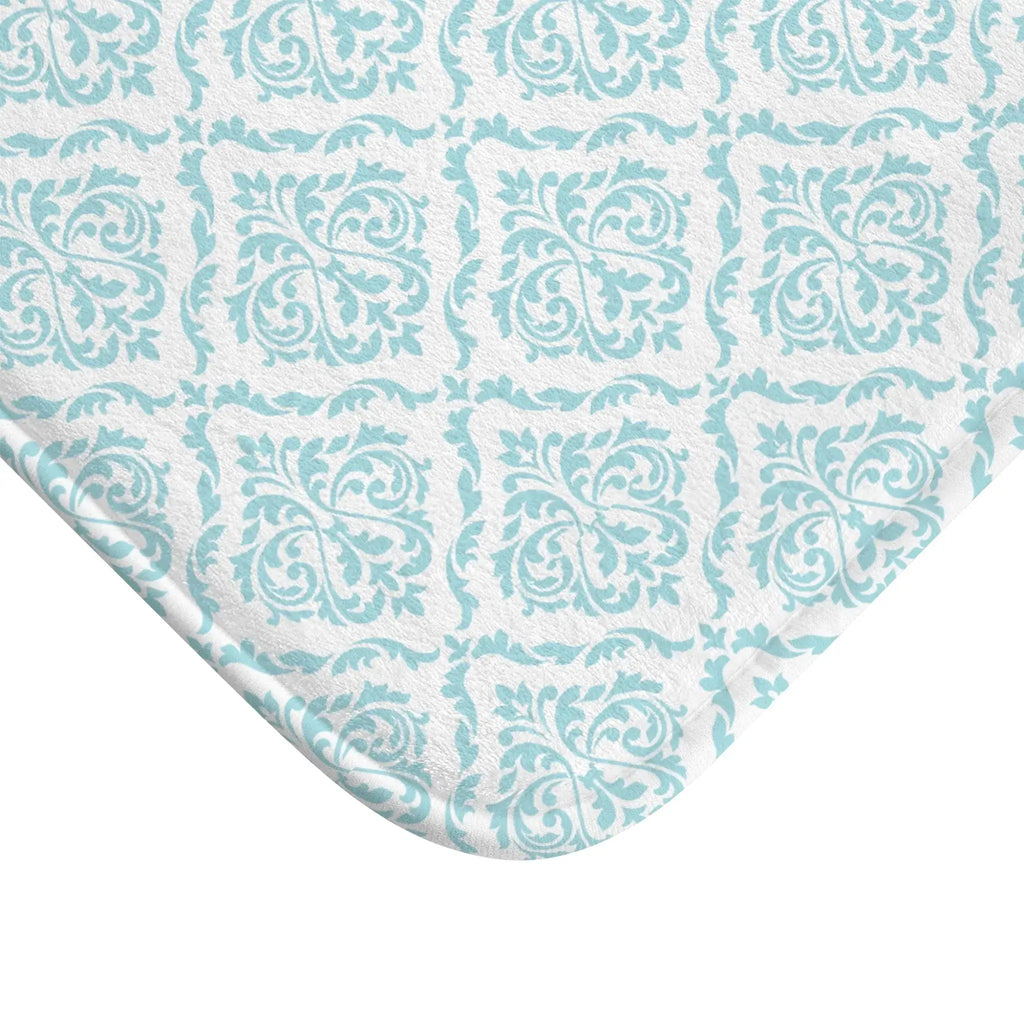 Texture detail of aqua damask bath mat showing soft, absorbent pile