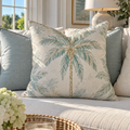 Aqua decorative pillow featuring a classic palm tree pattern.