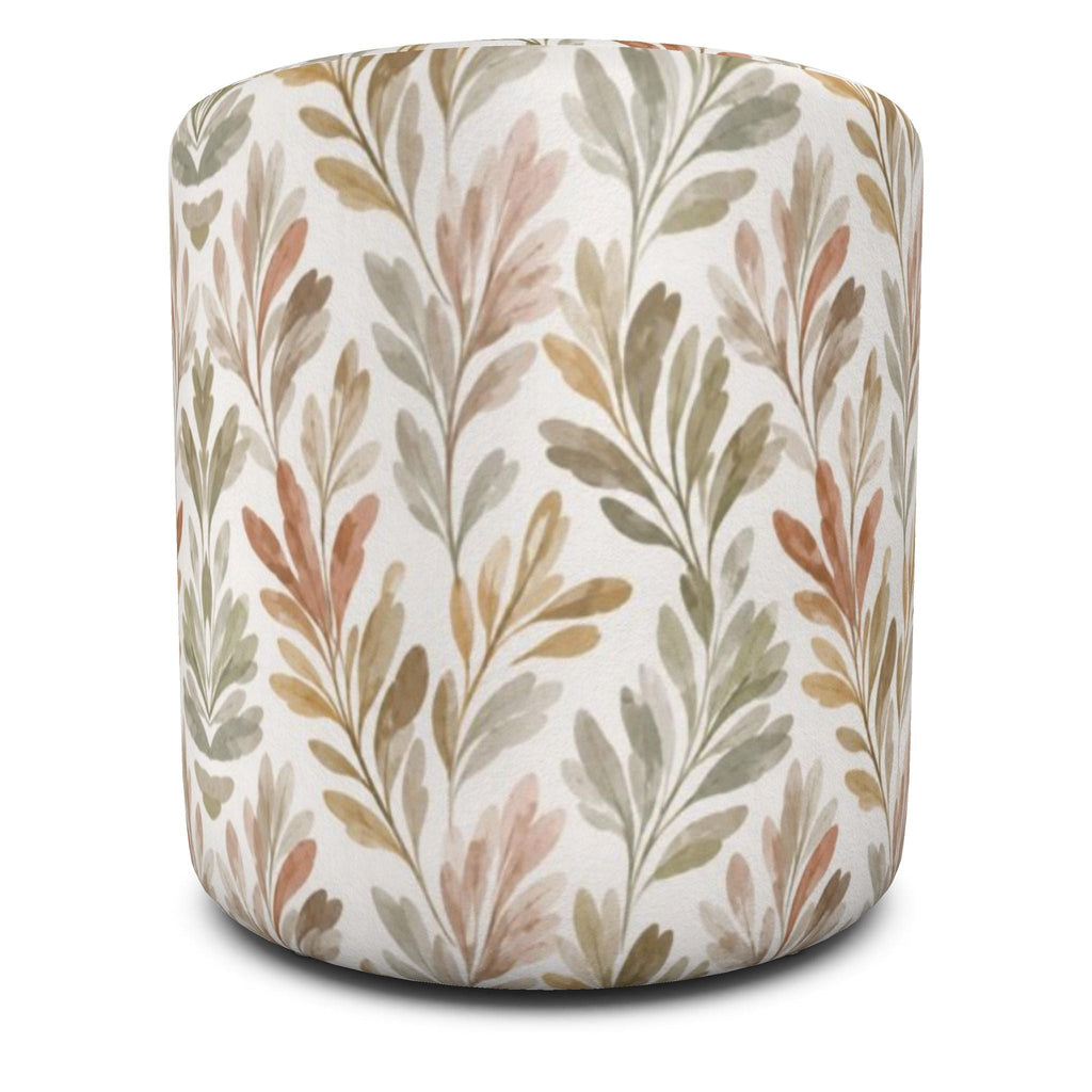Neutral round pouf with watercolor‑style foliage, suited to modern farmhouse, coastal, or organic interiors.