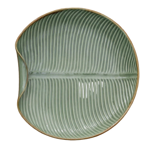 Banana Vibes banana-leaf ceramic serving plate with textured green glaze and brown rim.