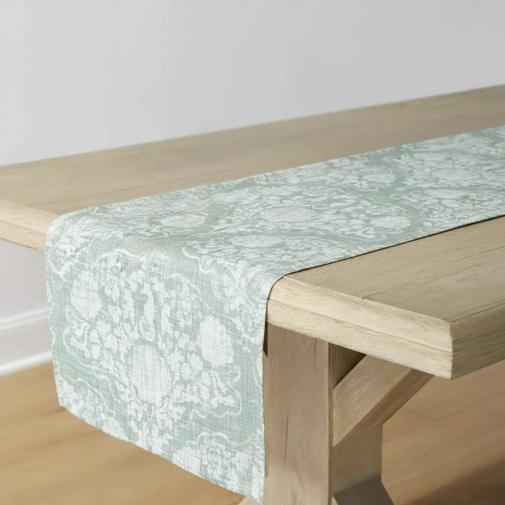 Coastal Crest Seahorse Table Runner in seafoam sage damask on a wooden table.