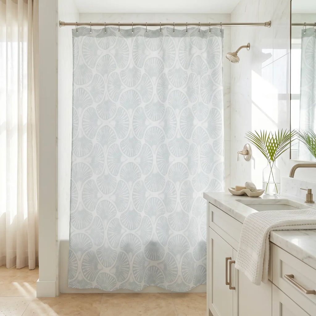 Coastal blue shell pattern shower curtain with soft beach-inspired design