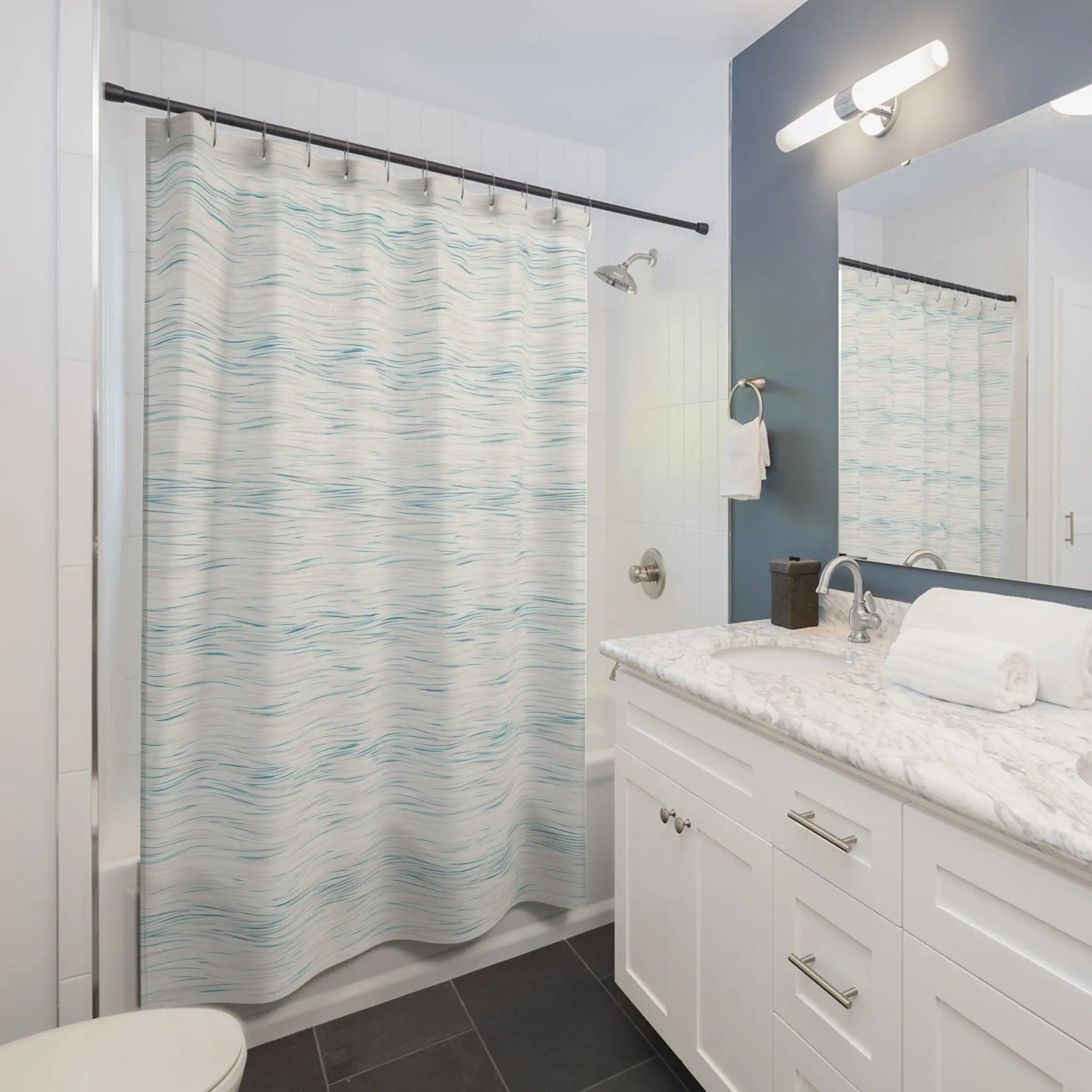 Coastal Breeze Shower Curtain, 100% polyester with pale blue watercolor waves, in a white bathroom.