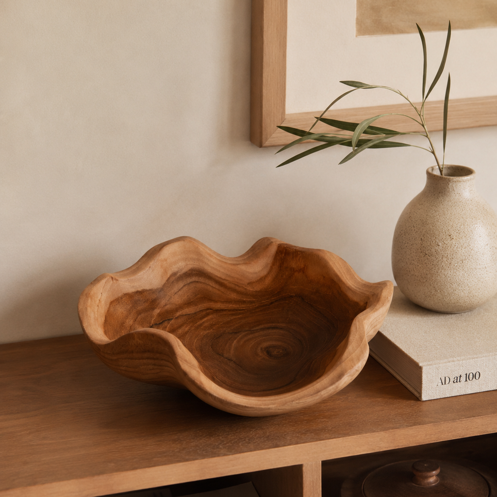 Coastal teak bowl with a warm natural finish and unique wavy edges.