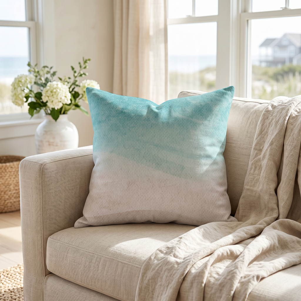 Beach ombre throw pillow on a couch in a coastal living room