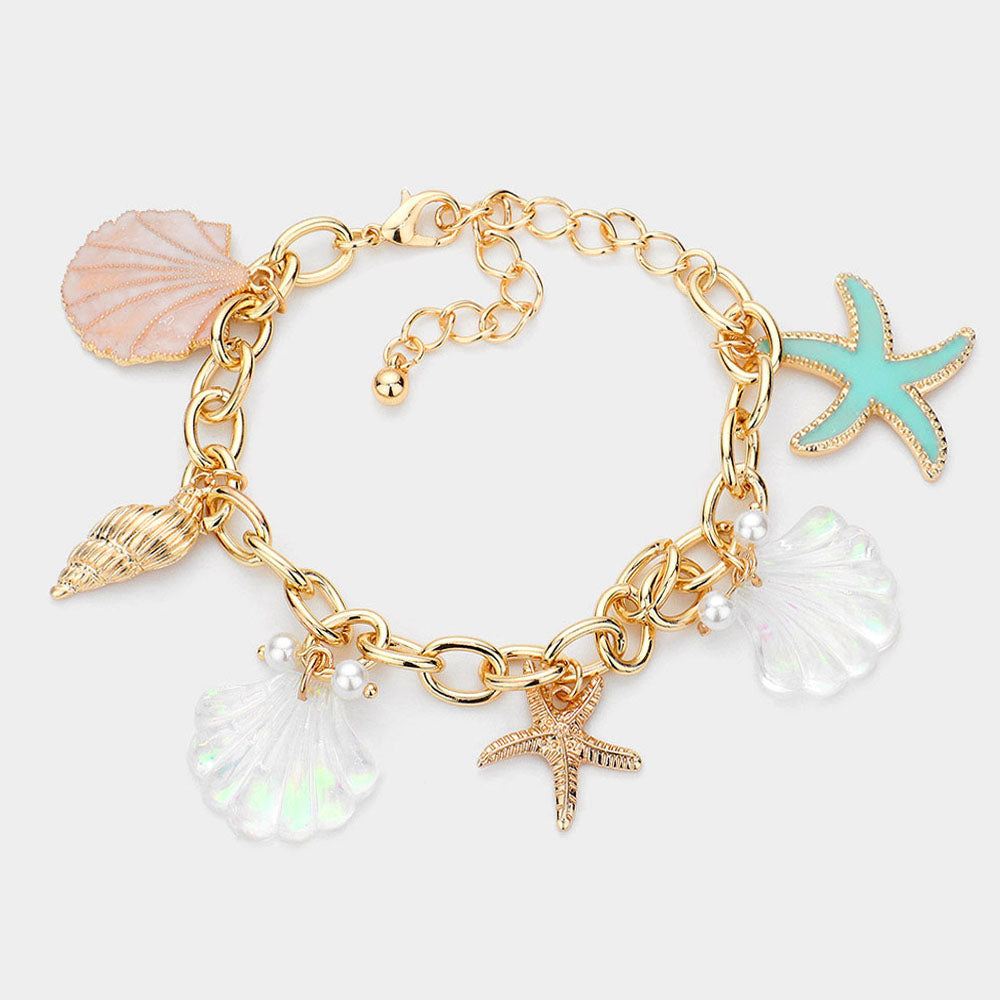 Shell conch starfish pearl charm station bracelet styled as coastal jewelry 