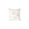 Neutral beige palm leaf pillow adding tropical texture to a coastal sofa