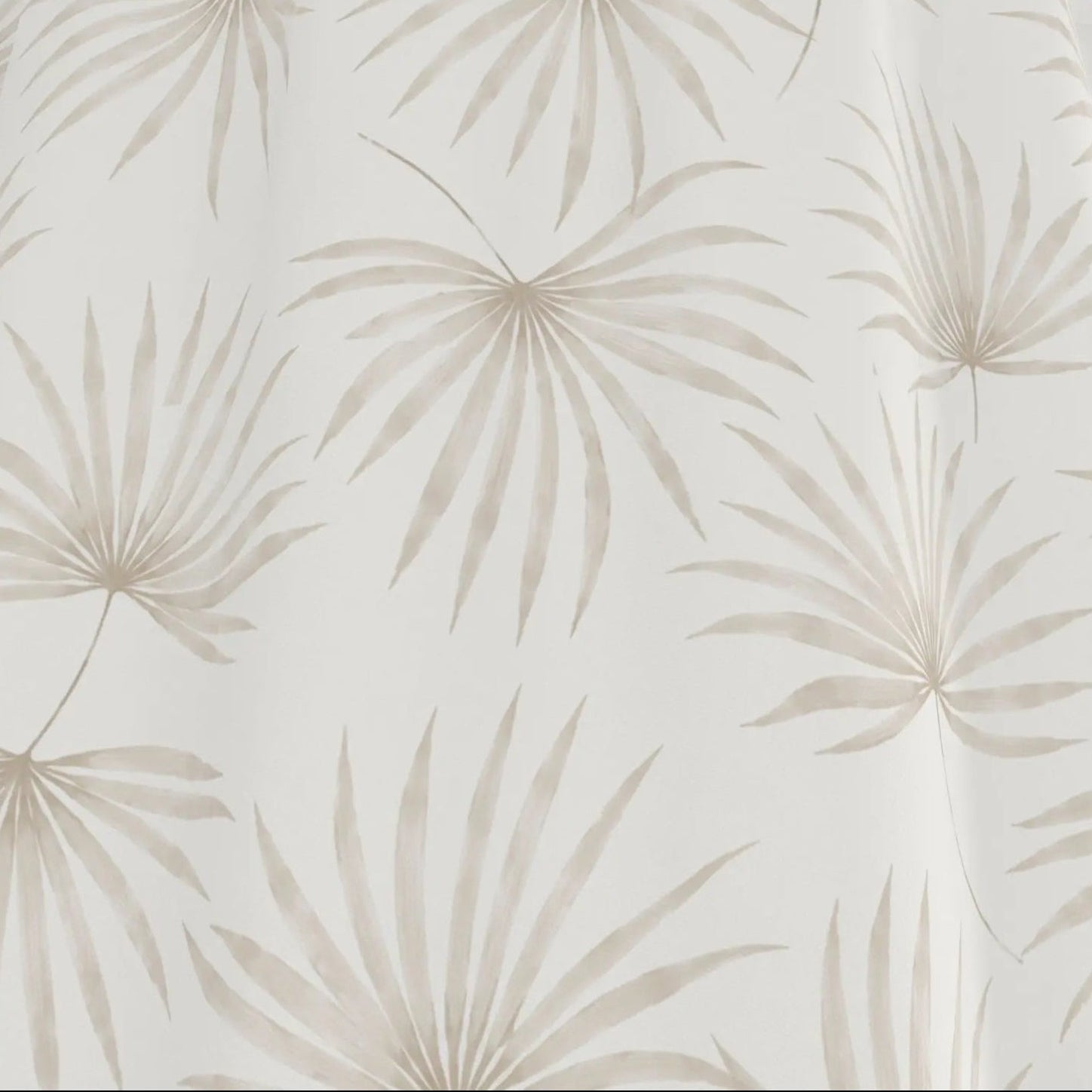 Closeup of beige palm leaf shower curtain showing the tropical palm pattern