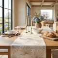 Neutral beige palm leaf table runner adding soft tropical texture to a coastal table