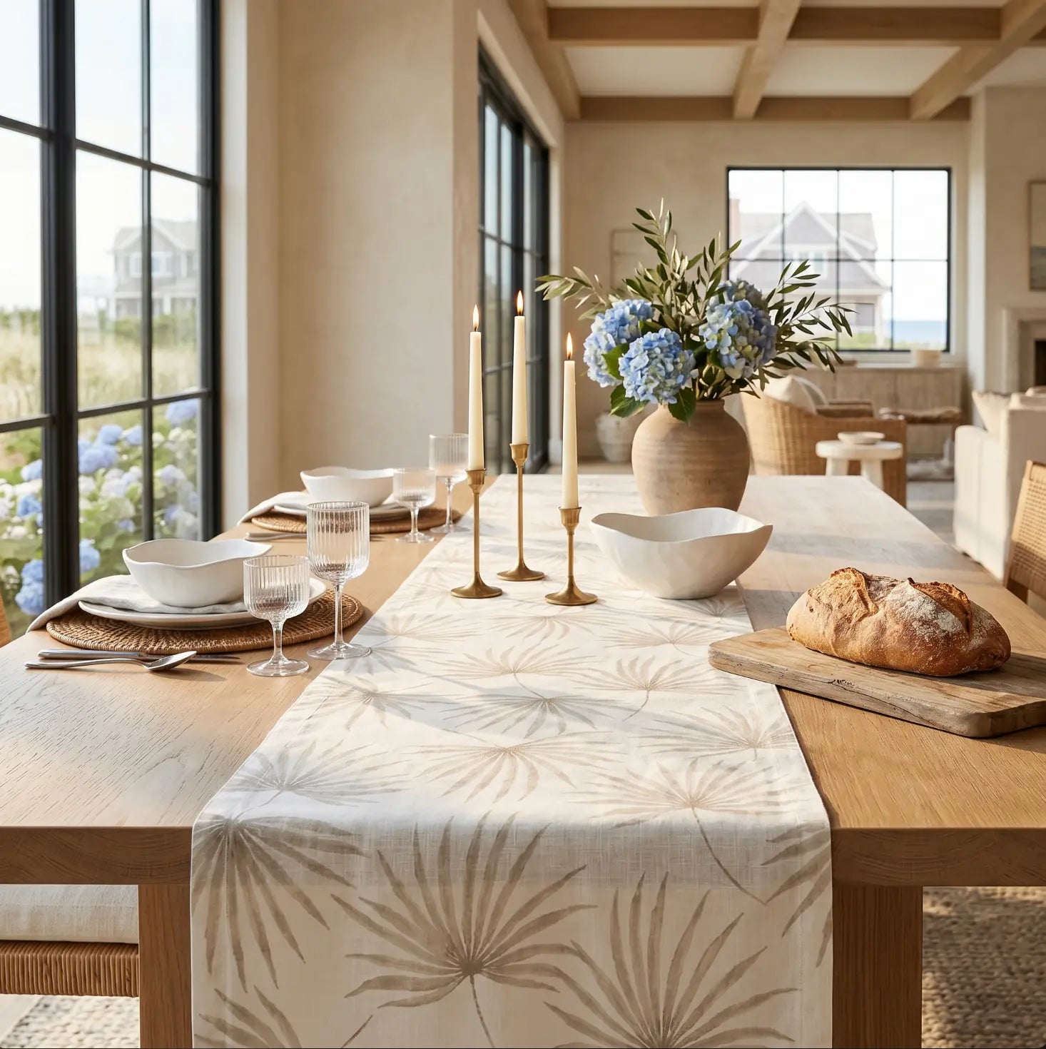 Neutral beige palm leaf table runner adding soft tropical texture to a coastal table