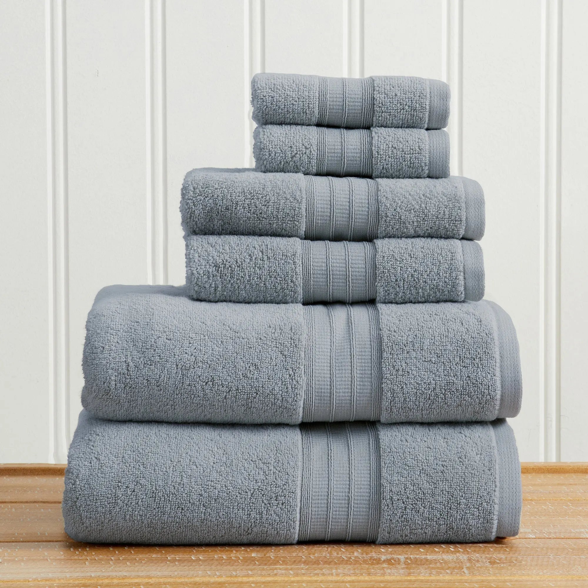 100% cotton premium bath towel set Chiara Collection in blue-gray, stacked towels.