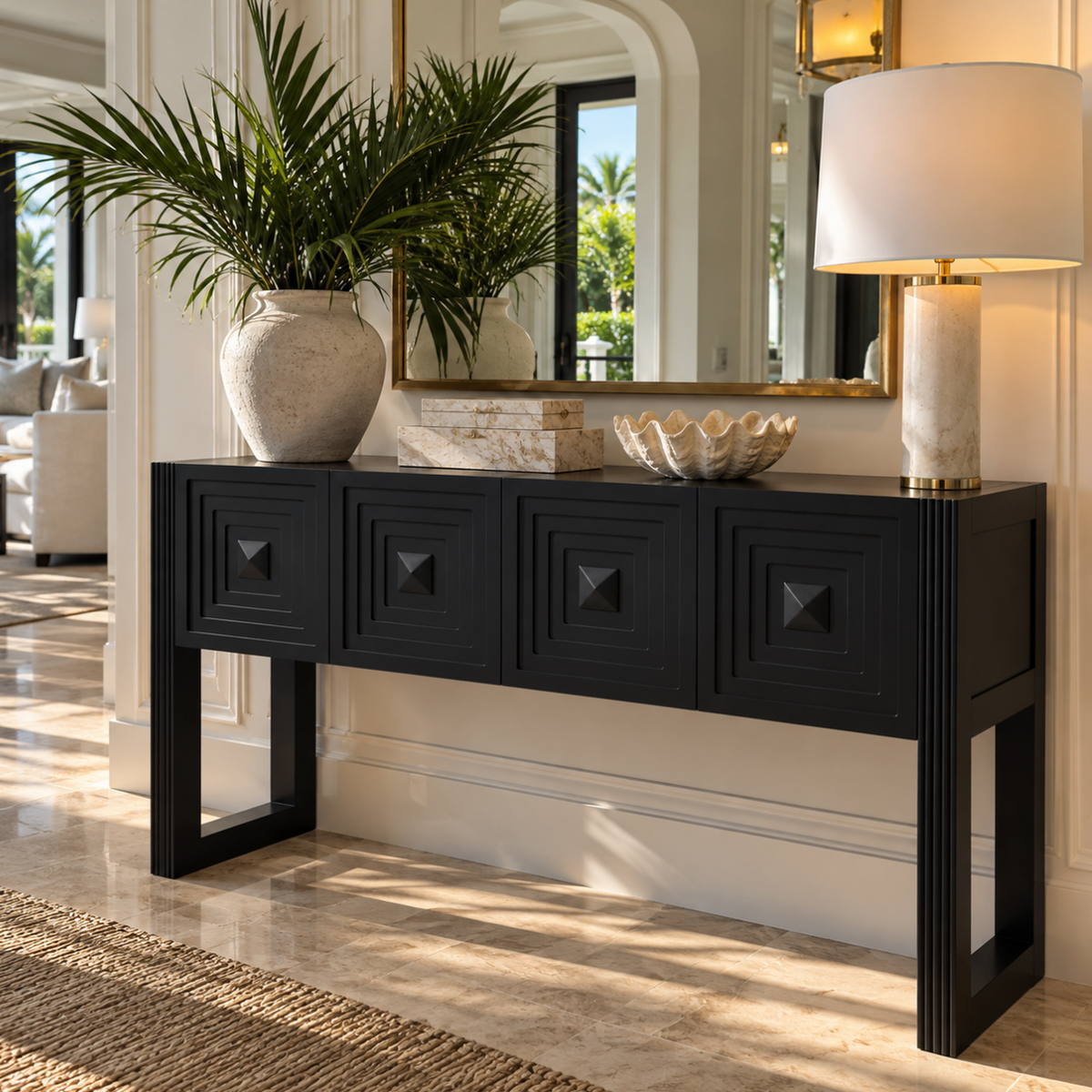 Black geometric console table with sculptural drawer detailing for a modern entryway.