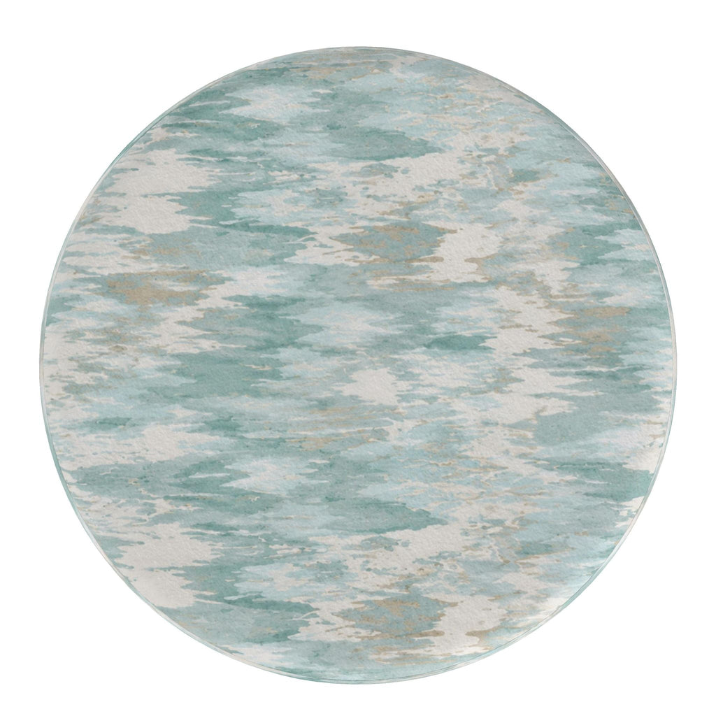 Soft blue watercolor pouf creating a calm focal point in a neutral coastal cottage living space.