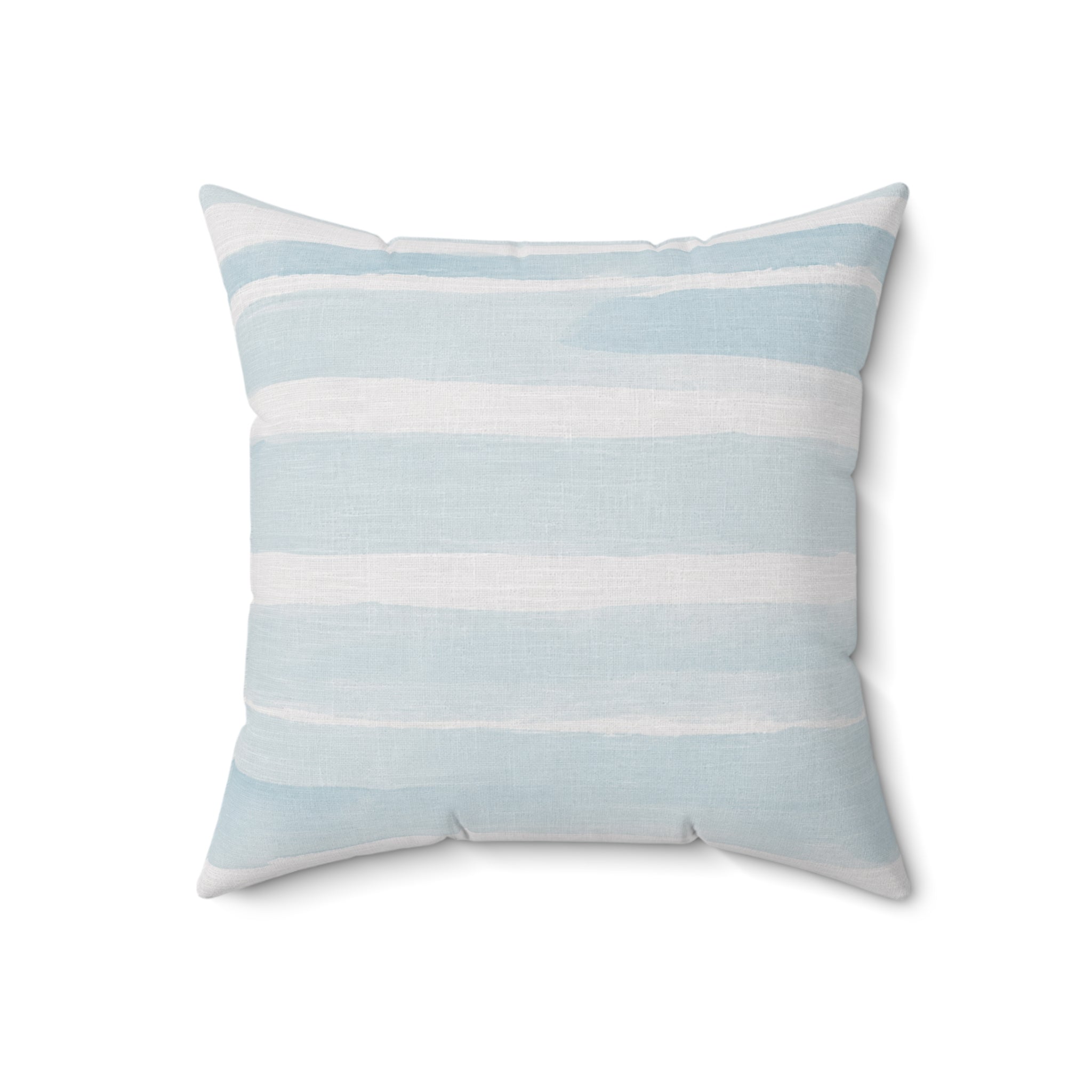 Blue and white striped coastal pillow for a neutral couch with beach inspired décor
