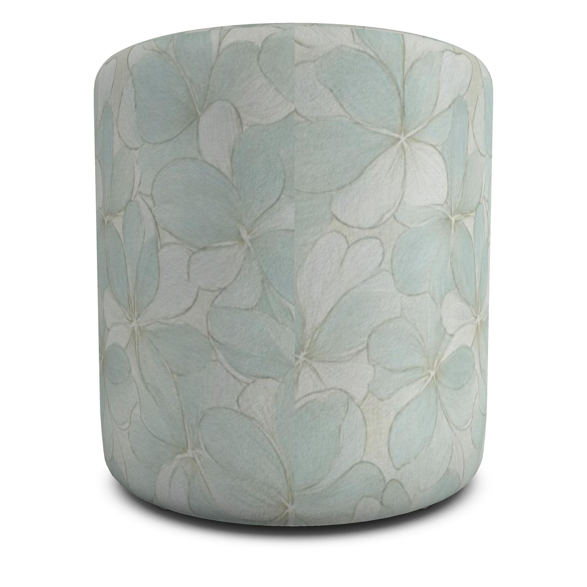 Two soft blue cylinder ottomans featuring oversized hydrangea-style flowers on a neutral area rug.
