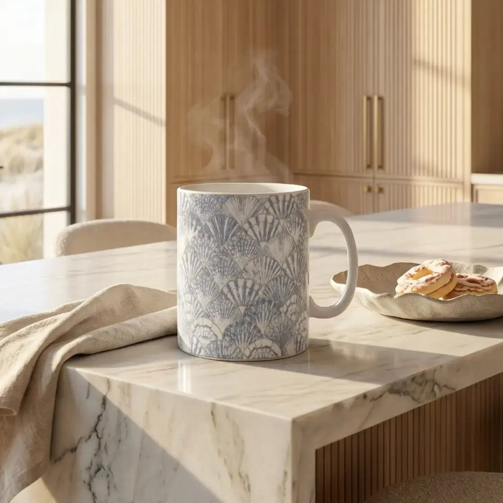 Blue and white seashell coffee mug for coastal kitchen decor