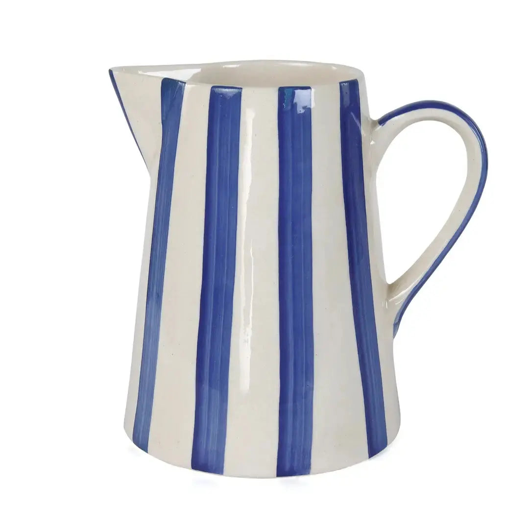 Closeup of blue and white stripe ceramic pitcher showing painted stripe detail