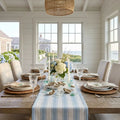 Blue and white striped table runner styled for a nautical beach house tablescape
