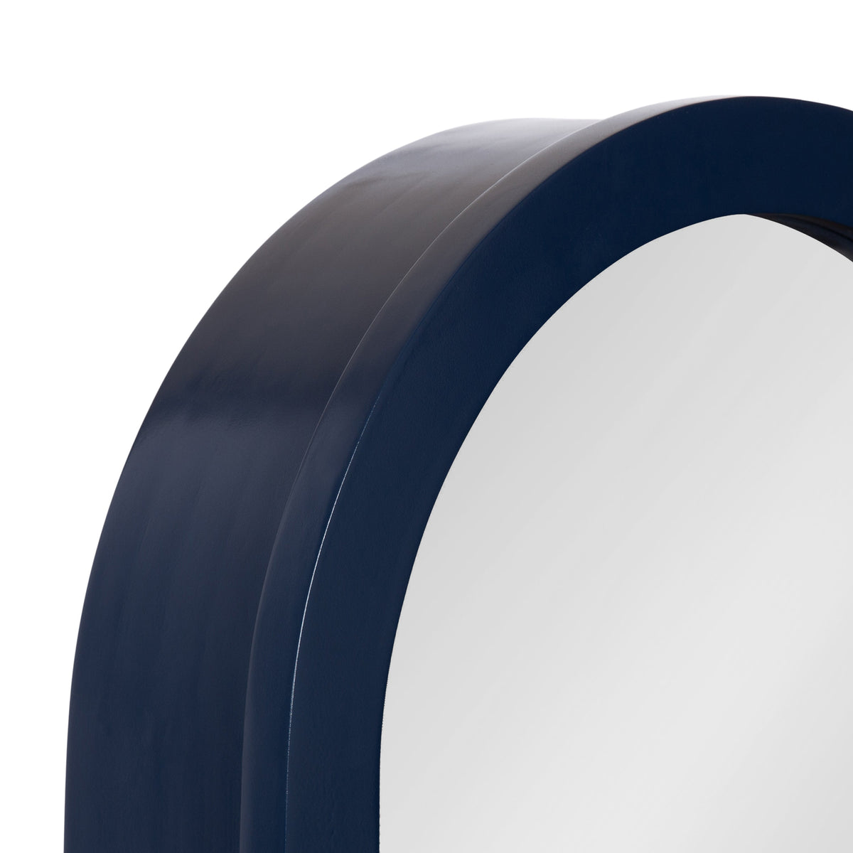 Blue arched mirror for a coastal entryway with a thick navy frame and clean architectural shape