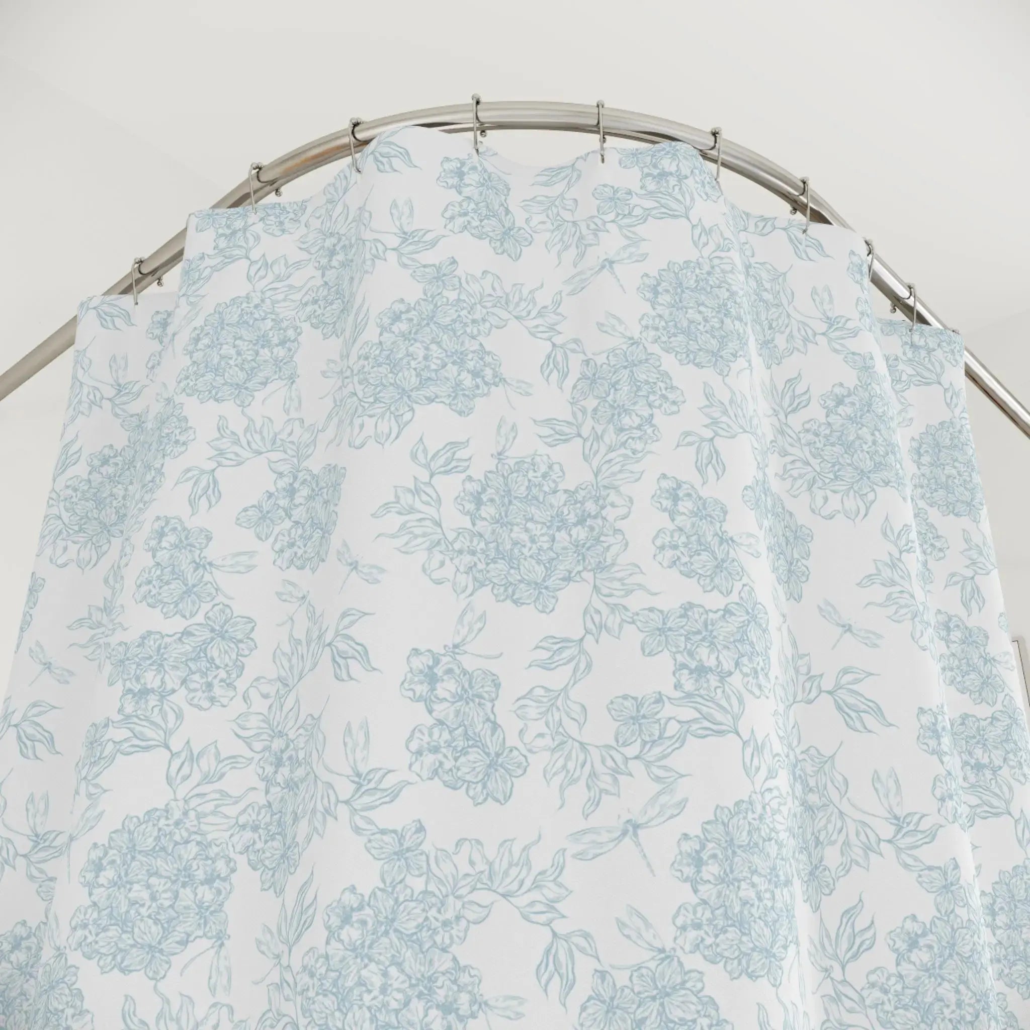 Sophisticated coastal bathroom featuring a blue botanical shower curtain