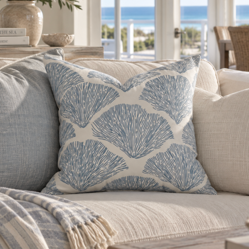 Blue coral-patterned throw pillow for a bright, relaxed coastal home.