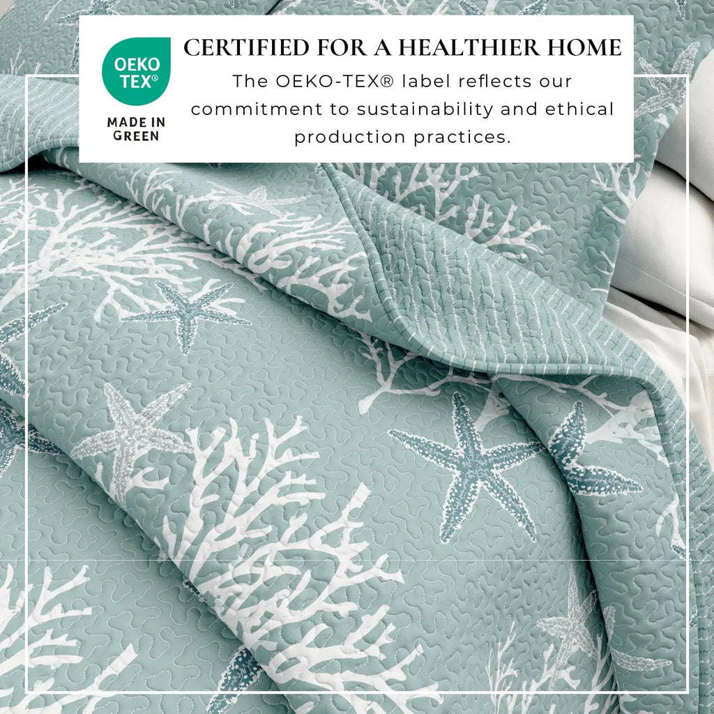 Blue coral pattern quilt set creating nautical coastal bedding in a seaside bedroom.