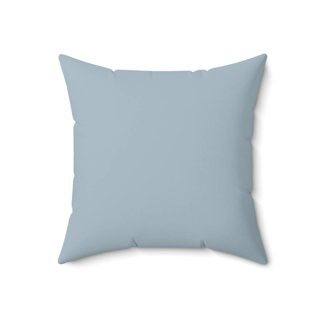 Blue coral pattern throw pillow for an accent chair with coastal decor