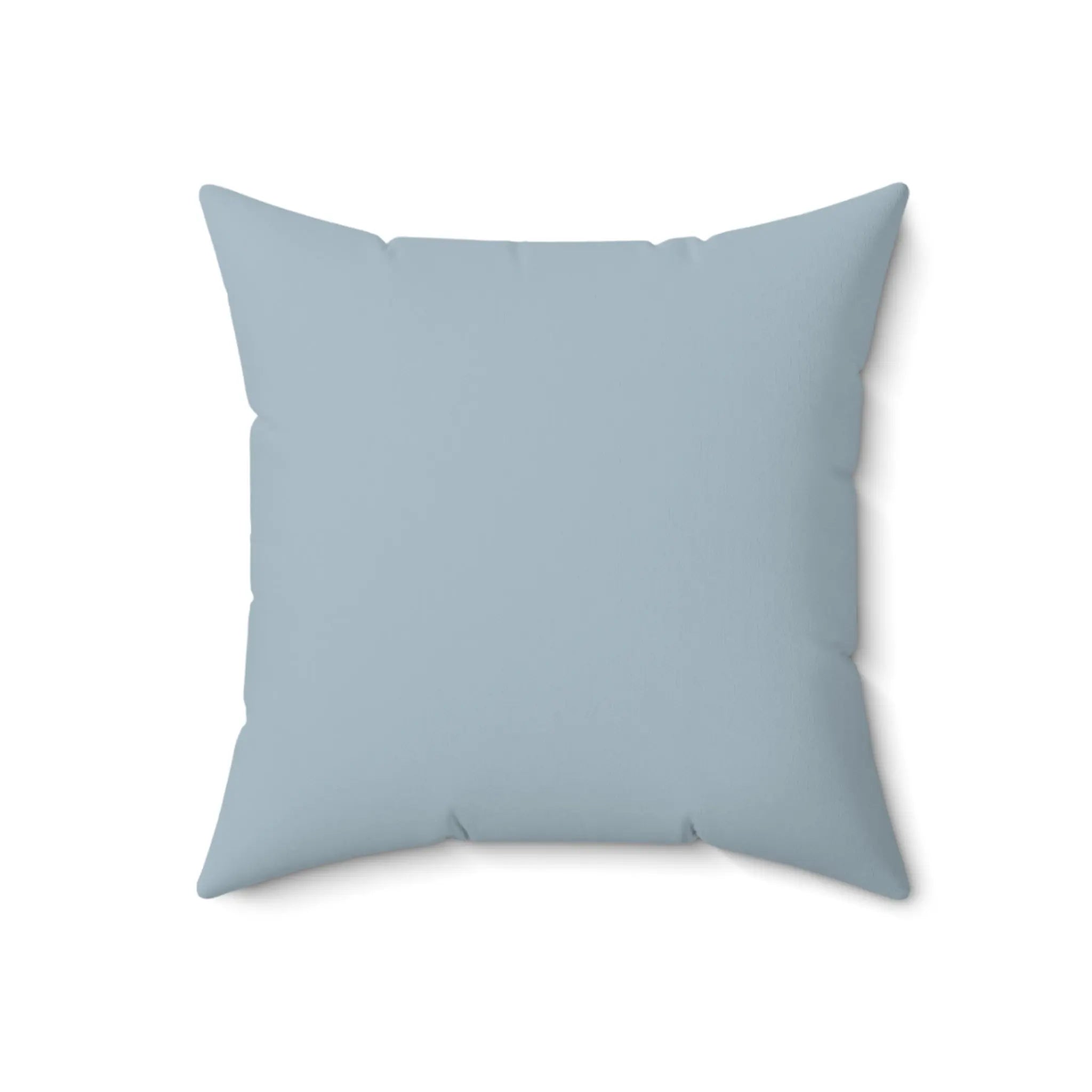 Blue coral pattern throw pillow for an accent chair with coastal decor