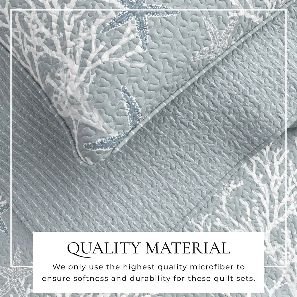 Blue coral quilt set on a bed in a modern coastal farmhouse bedroom