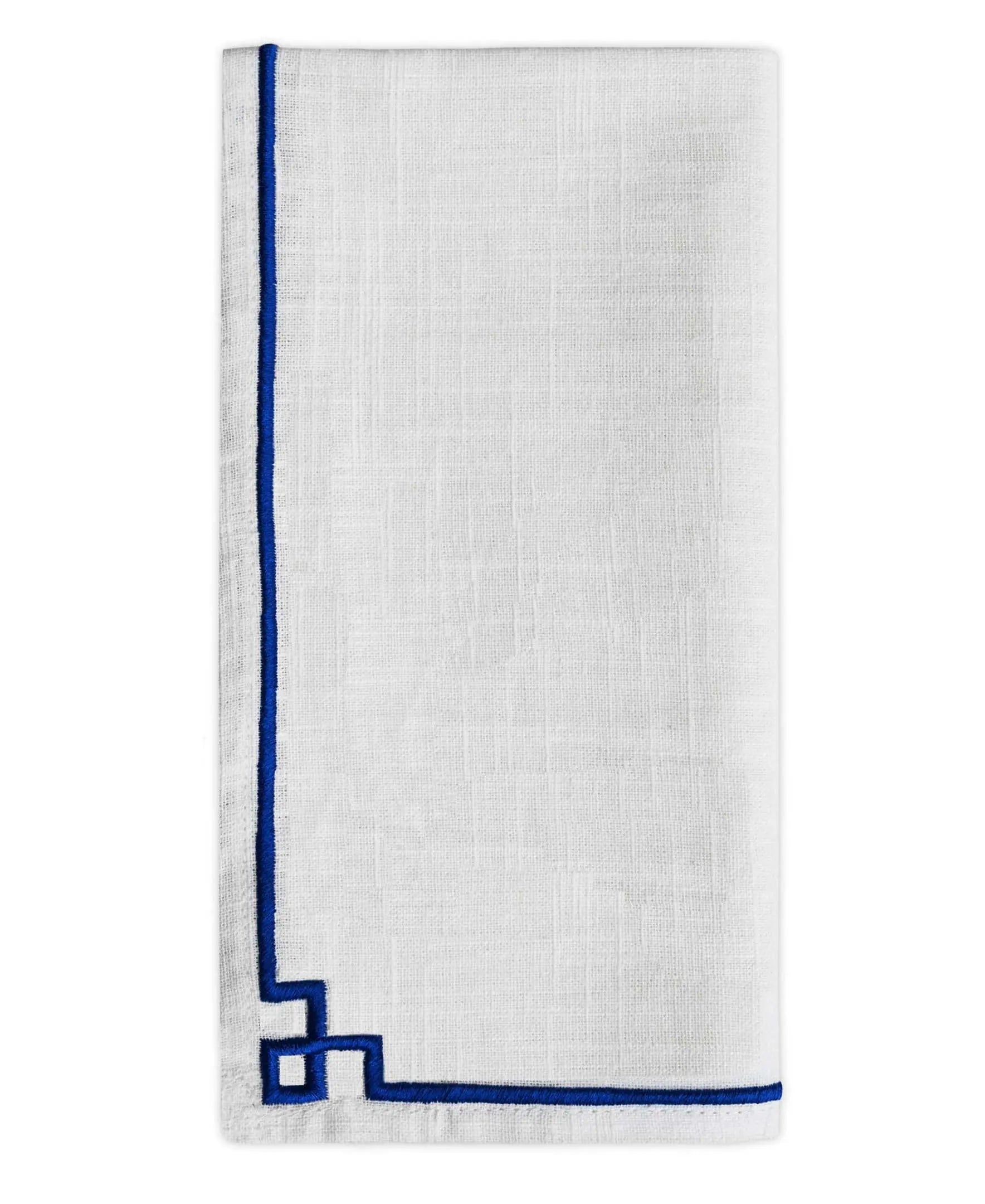 Closeup of blue embroidered cloth napkins set of four showing stitched detail.