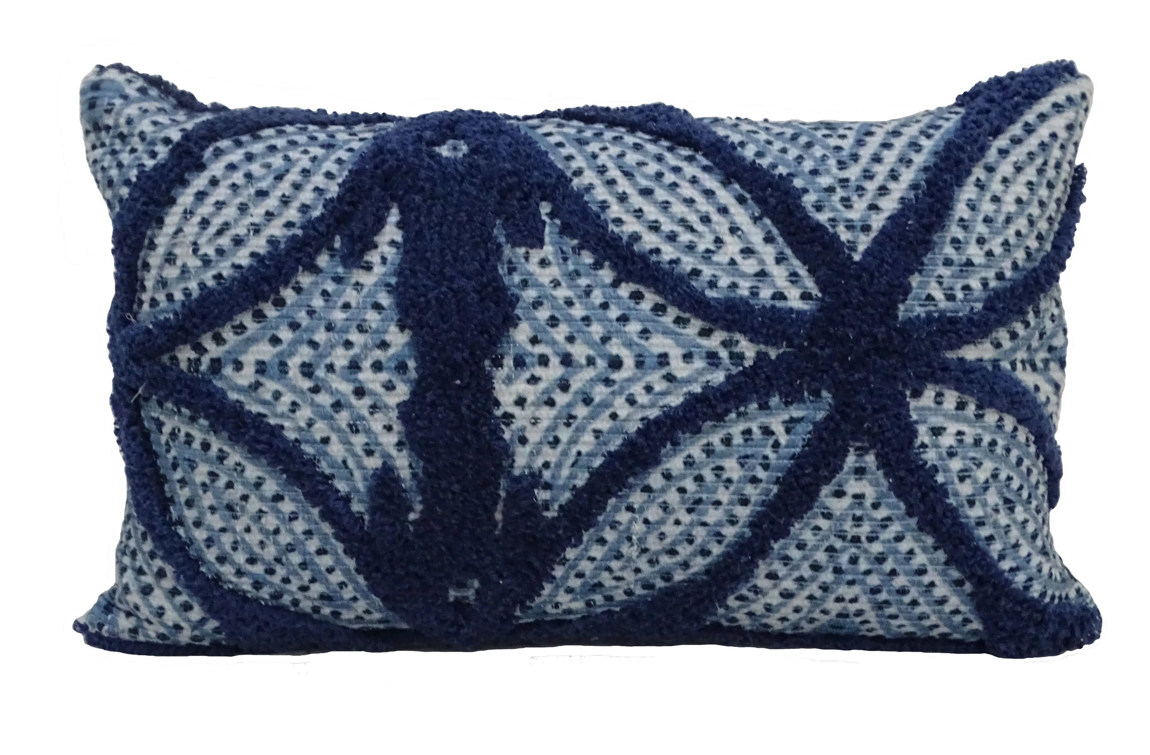 Closeup of blue embroidered pattern 14 x 24 lumbar pillow showing stitched detail