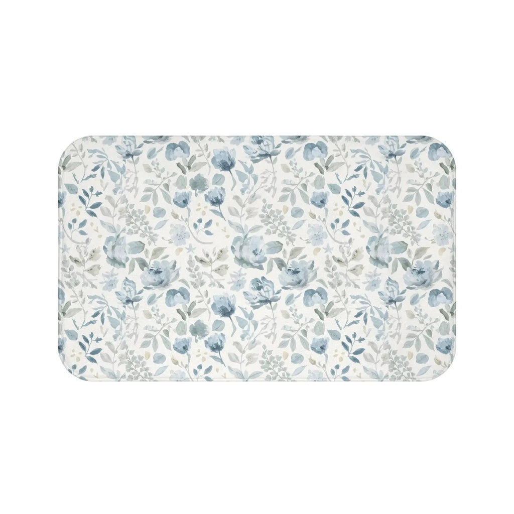 Closeup of blue floral pattern on soft bath mat