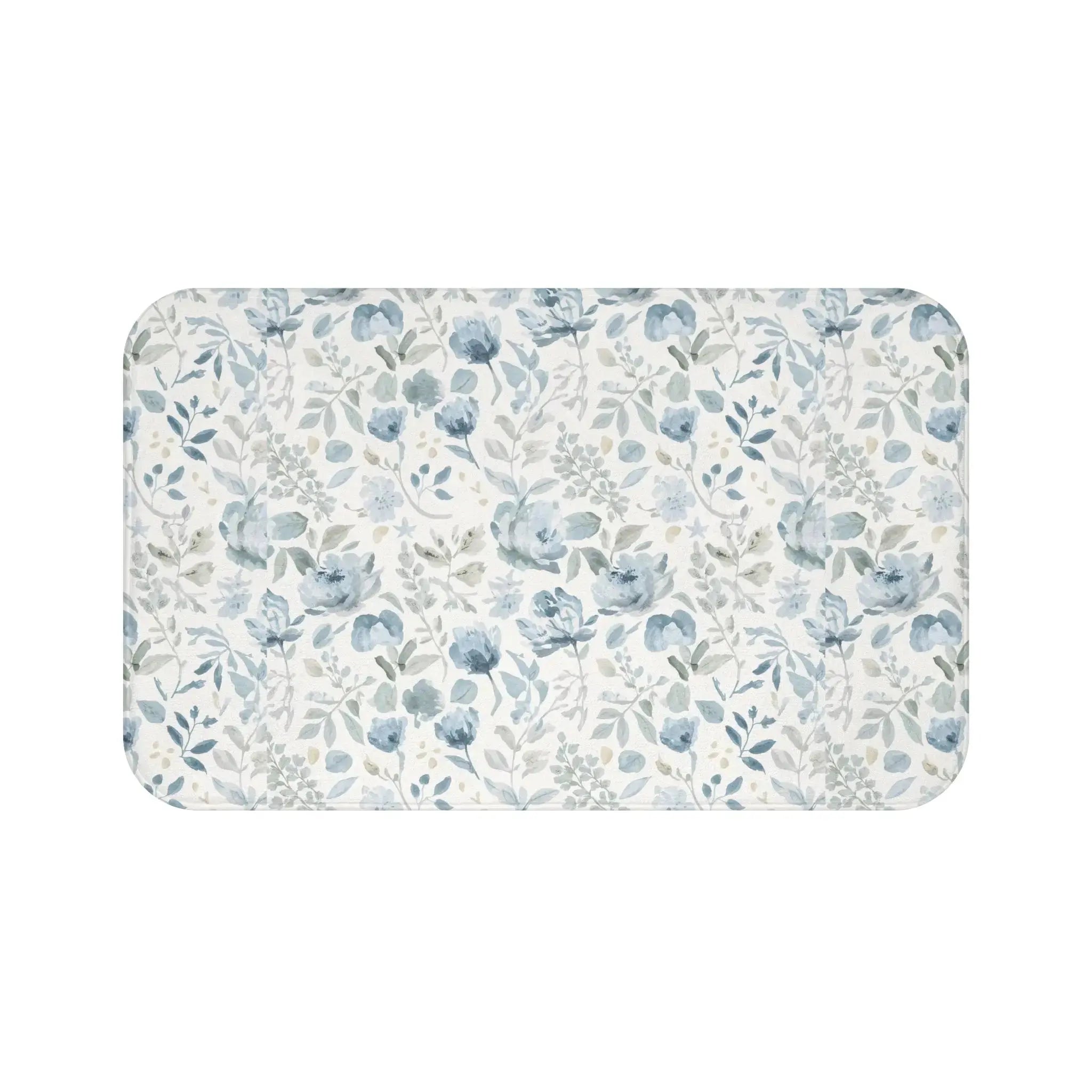 Closeup of blue floral pattern on soft bath mat