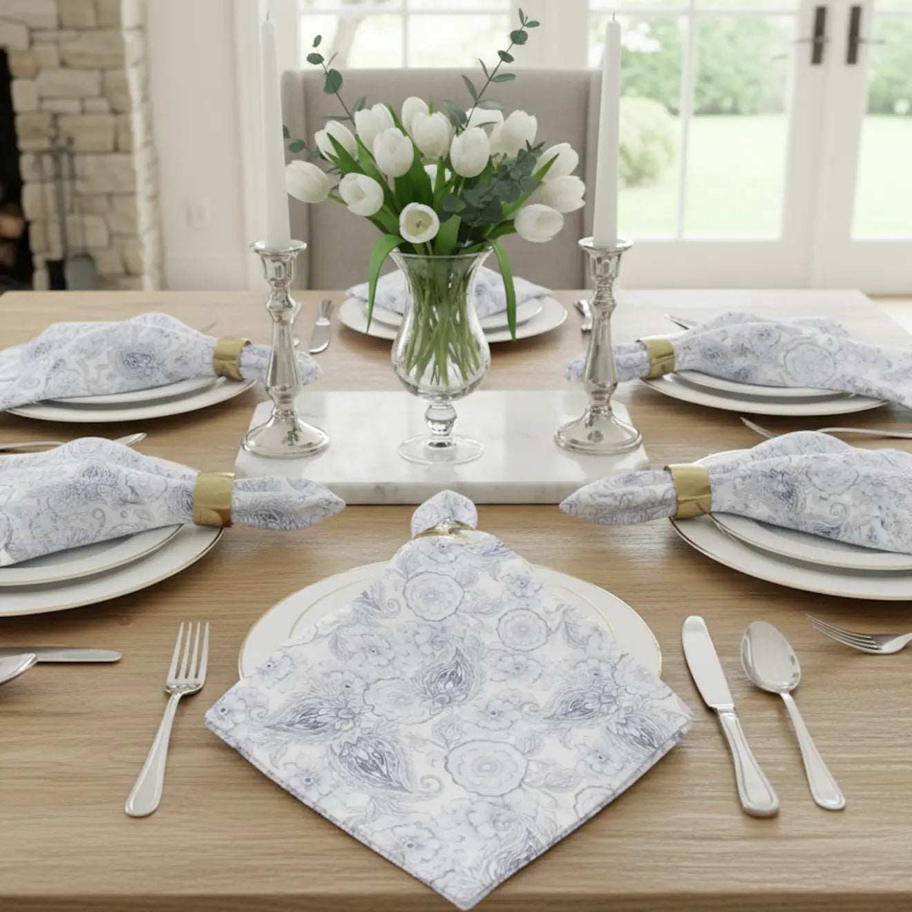 Blue Paisley Floral Cloth Napkins, set of four, with hand-drawn floral motifs in soft blue tones on a table.