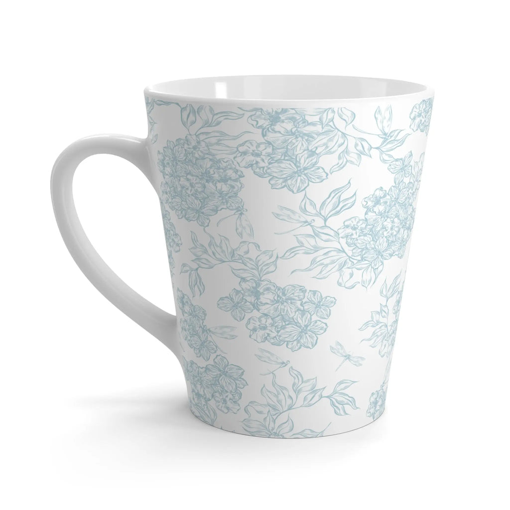 White mug with light blue floral pattern on a white background
